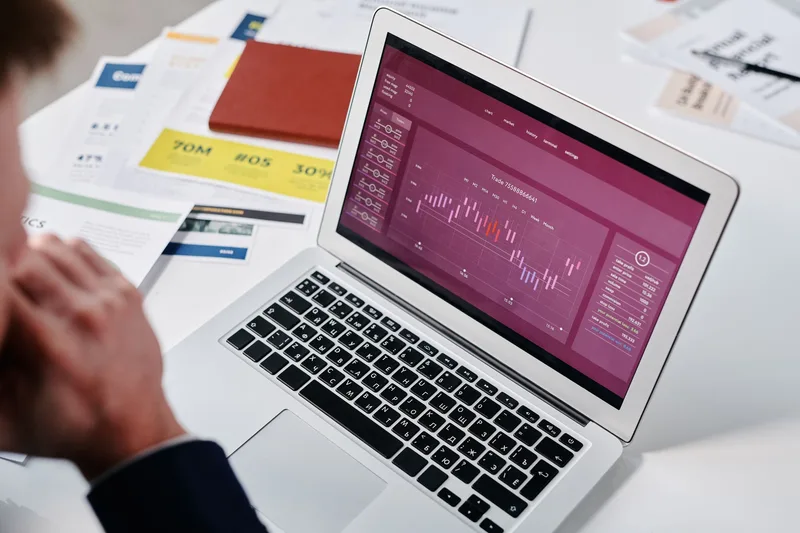 Seller reviewing payment analytics and fee calculations on a laptop