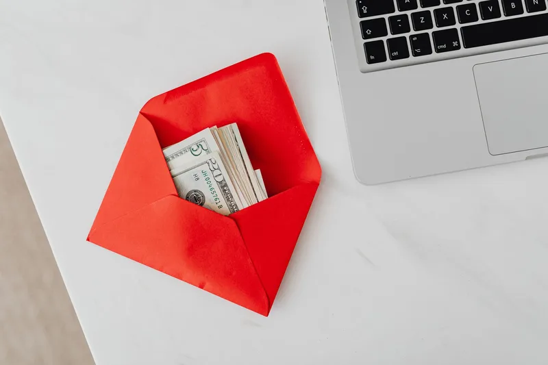Bank payout and payment settlement illustration with laptop and cash envelope